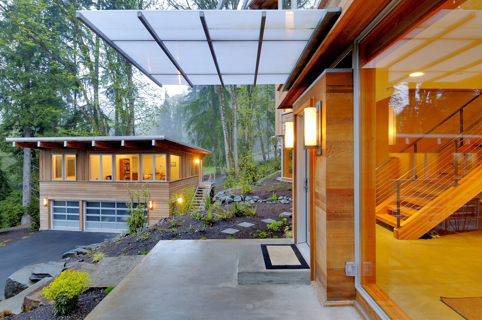 Modern home entrance with wood siding