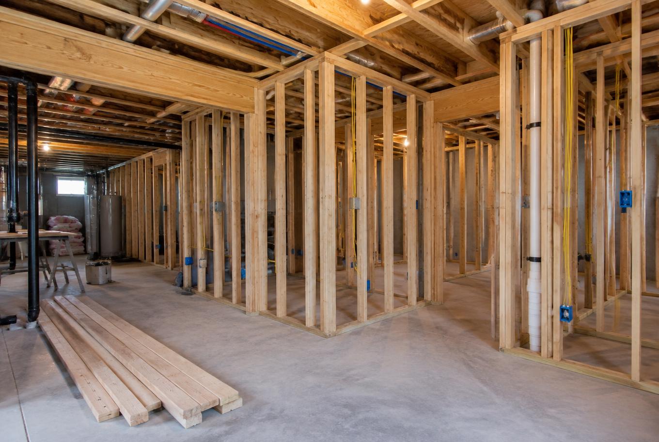 Basement finishing project with framed walls and electrical rough-in